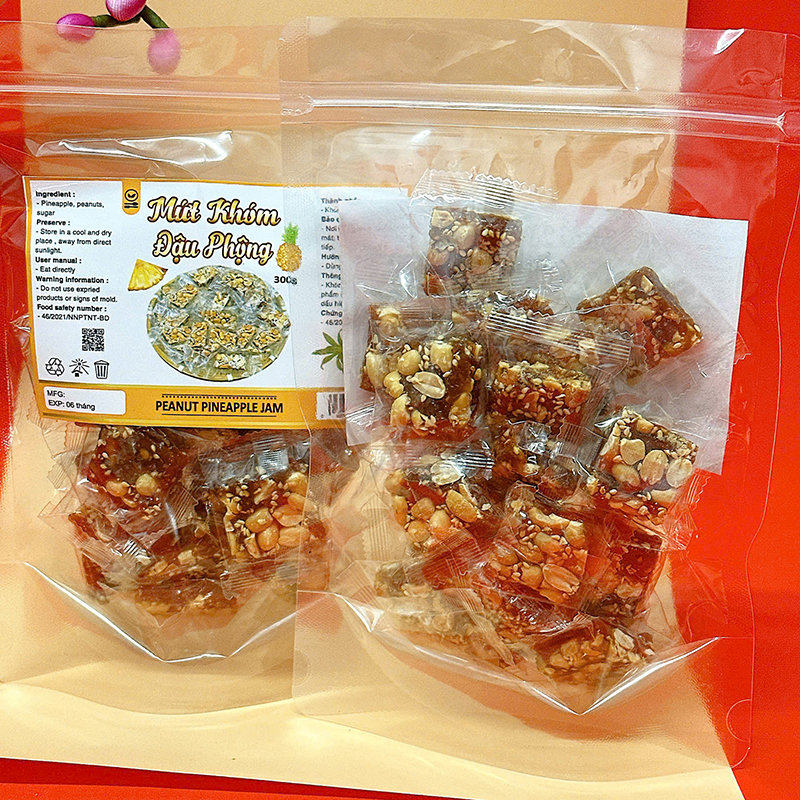 23380_z6125808216947-37f22420ae99fb385ed40ebb02067bd7_20241214103019-2.jpg Mứt Khóm Đậu Phộng Túi Zip 300g - MKDPTZ