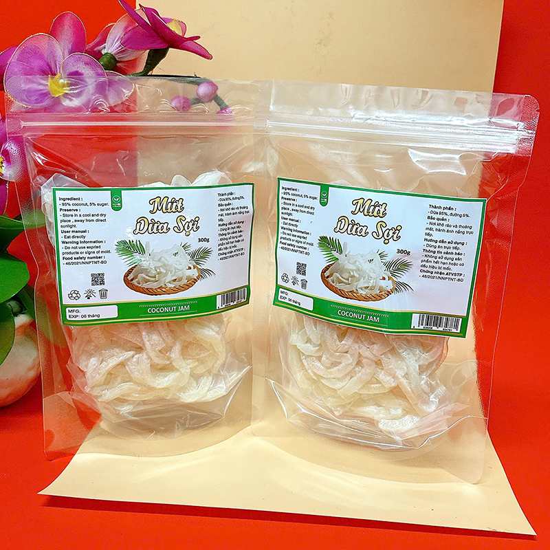 23383_z6129056901082-6e534c78cc3ff3cff29fc2906fefea3f_20241214124302-2.jpg Mứt Dừa Sợi Túi Zip 300g - MDNMHCK