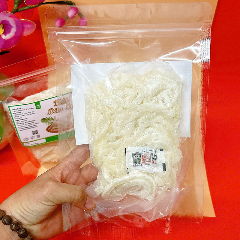 23383_z6129056907229-749fbd1f94aa384efbc90341dfb77e22_20241214124301-2.jpg Mứt Dừa Sợi Túi Zip 300g - MDNMHCK