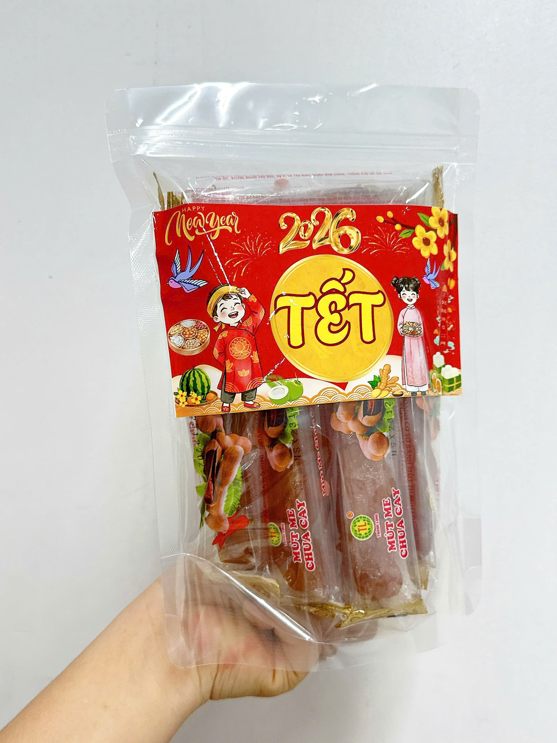 25877_z7393749517504-6924af77c8069a84694cfa723fb03ec0_20260103173104.png Mứt Me Chua Cay Túi Zip 300g - MMCCTZ300